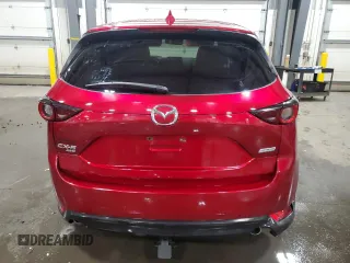2018 Mazda CX-5 Touring z VIN JM3KFBCM5J0462676, wystawiony jako Copart lot #57892015 z przebiegiem 76 566 mil mil oraz Szkoda całkowita • Salvage title. Historia ofert i sprzedaży dostępna na DreamBid. Obrazek 6.