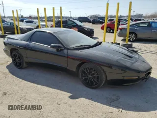 1997 Pontiac Firebird with VIN 2G2FS22K8V2212704, listed as a Copart auction lot 48853145 with 130,474 mi miles and Salvage Title. Bid and sale history available at carsss.com. Image 4.