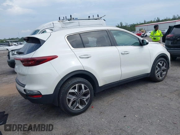 2021 Kia Sportage EX with VIN KNDPN3AC5M7856515, listed as a IAAI auction lot 41879128 with 56,537 mi miles and . Bid and sale history available at DreamBid. Image 4.