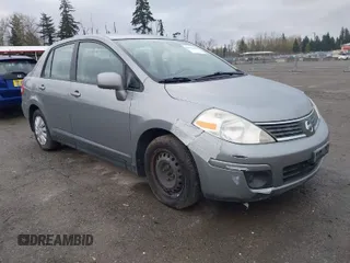 2009 Nissan Versa 1.8 SL with VIN 3N1BC11EX9L403728, listed as a IAAI auction lot 41912469 with 119,324 mi miles. Bid and sale history available at carsss.com. Image 1.