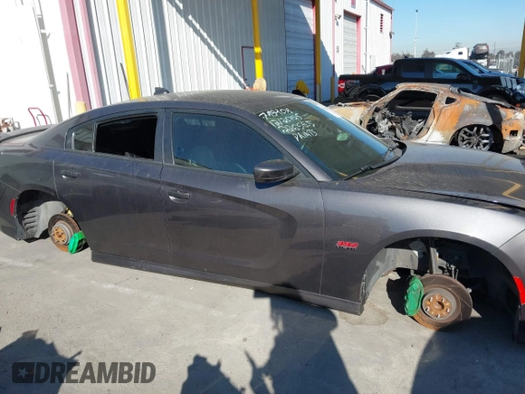 2019 Dodge Charger Scat Pack with VIN 2C3CDXGJ2KH564051, listed as a IAAI auction lot 41255283 with 64,687 mi miles and . Bid and sale history available at DreamBid. Image 13.