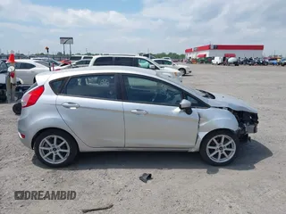 2019 Ford Fiesta SE z VIN 3FADP4EJ9KM107124, wystawiony jako IAAI lot #42067464 z przebiegiem 89 076 mil mil oraz . Historia ofert i sprzedaży dostępna na DreamBid. Obrazek 14.
