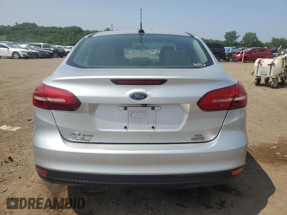 2017 Ford Focus SE with VIN 1FADP3FE7HL290271, listed as a Copart auction lot 60665615 with 130,409 mi miles and Salvage title. Bid and sale history available at DreamBid. Image 6.