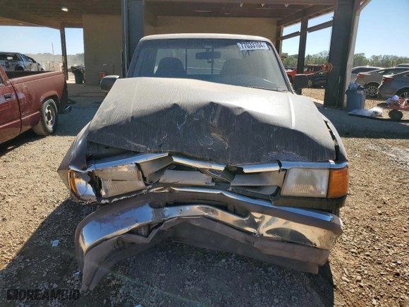 1995 Ford Ranger Splash with VIN 1FTCR14X2STA61772, listed as a Copart auction lot 77033104 with 129,784 mi miles and Salvage Title. Bid and sale history available at carsss.com. Image 5.