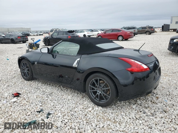 2014 Nissan 370Z Touring with VIN JN1AZ4FH1EM620177, listed as a Copart auction lot 42581255 with 106,957 mi miles and Salvage Title. Bid and sale history available at DreamBid. Image 2.