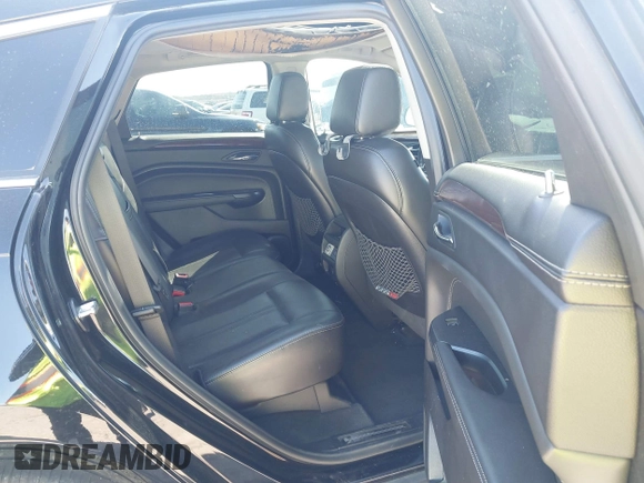 2014 Cadillac SRX Performance Collection z VIN 3GYFNCE35ES517868, wystawiony jako IAAI lot #41775522 z przebiegiem 166 960 mil mil oraz . Historia ofert i sprzedaży dostępna na DreamBid. Obrazek 8.
