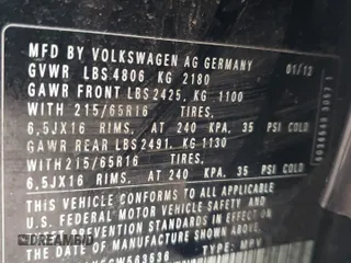2012 Volkswagen Tiguan SE z VIN WVGAV7AX5CW563536, wystawiony jako Copart lot #52407665 z przebiegiem 136 263 mil mil oraz Szkody całkowita. Historia ofert i sprzedaży dostępna na DreamBid. Obrazek 13.