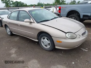 1998 Ford Taurus LX z VIN 1FAFP52U9WA166500, wystawiony jako IAAI lot #42295719 z przebiegiem 141 468 mil mil oraz . Historia ofert i sprzedaży dostępna na DreamBid. Obrazek 1.