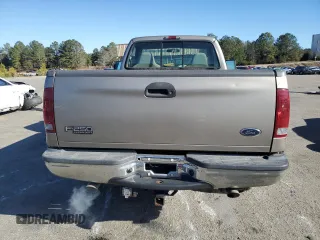 2002 Ford F-250 XL with VIN 1FTNF21L02EA83007, listed as a Copart auction lot 87880345 with 104,889 mi miles and Salvage title. Bid and sale history available at DreamBid. Image 6.