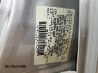 2009 Nissan Versa S z VIN 3N1BC11E69L406027, wystawiony jako Copart lot #50904135 z przebiegiem 163 718 mil mil oraz Szkoda całkowita • Salvage title. Historia ofert i sprzedaży dostępna na DreamBid. Obrazek 12.