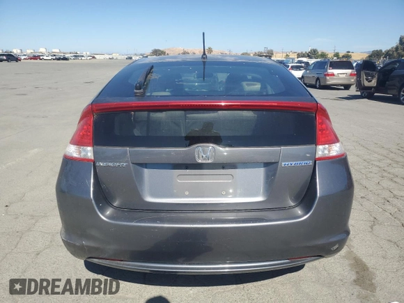2011 Honda Insight EX z VIN JHMZE2H71BS006434, wystawiony jako Copart lot #58045495 z przebiegiem 270 645 mil mil oraz Czysty tytuł • Clean title. Historia ofert i sprzedaży dostępna na DreamBid. Obrazek 6.