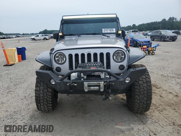2013 Jeep Wrangler Unlimited Rubicon with VIN 1C4BJWFG5DL661282, listed as a Copart auction lot 57471035 with 128,400 mi miles and Salvage title. Bid and sale history available at DreamBid. Image 5.