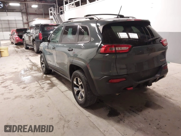 2015 Jeep Cherokee Trailhawk with VIN 1C4PJMBS6FW724931, listed as a IAAI auction lot 41602181 with 153,340 mi miles and . Bid and sale history available at carsss.com. Image 3.