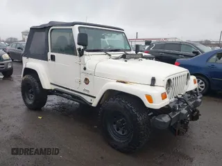 1998 Jeep Wrangler Sahara z VIN 1J4FY49S4WP711306, wystawiony jako IAAI lot #41794639 z przebiegiem 223 670 mil mil oraz . Historia ofert i sprzedaży dostępna na DreamBid. Obrazek 1.