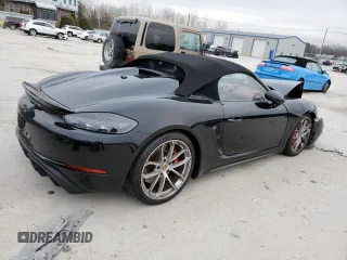 2023 Porsche 718 Spyder z VIN WP0CC2A81PS222016, wystawiony jako Copart lot #84939084 z przebiegiem 20 612 mil mil oraz Szkody całkowita. Historia ofert i sprzedaży dostępna na DreamBid. Obrazek 3.