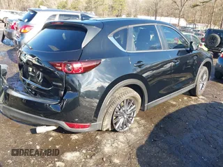 2021 Mazda CX-5 Touring with VIN JM3KFBCM9M0483082, listed as a IAAI auction lot 41305127 with 42,926 mi miles. Bid and sale history available at carsss.com. Image 4.