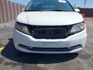 2015 Honda Odyssey EX-L with VIN 5FNRL5H67FB017554, listed as a IAAI auction lot 41974821 with 76,130 mi miles and . Bid and sale history available at carsss.com. Image 6.
