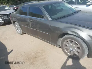 2009 Chrysler 300 Touring with VIN 2C3LA53V09H520923, listed as a IAAI auction lot 40408803 with 216,747 mi miles. Bid and sale history available at carsss.com. Image 6.