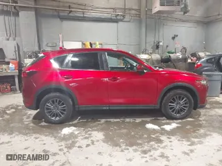 2021 Mazda CX-5 Touring with VIN JM3KFACM3M0331597, listed as a IAAI auction lot 41687333 with 68,562 mi miles. Bid and sale history available at carsss.com. Image 13.
