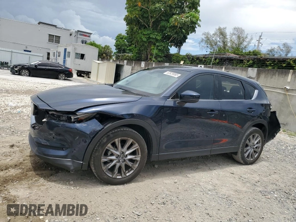 2021 Mazda CX-5 Grand Touring z VIN JM3KFBDM5M0464611, wystawiony jako Copart lot #62829065 z przebiegiem 20 525 mil mil oraz Nie do naprawy • Non repairable. Historia ofert i sprzedaży dostępna na DreamBid. Obrazek 1.