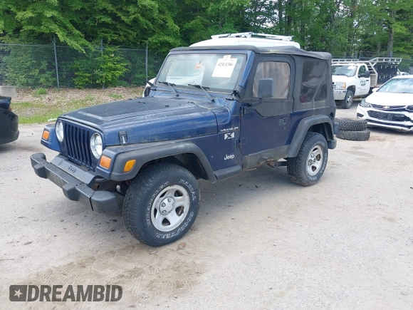 2002 Jeep Wrangler X with VIN 1J4FA39S82P735794, listed as a IAAI auction lot 42411386 with 141,219 mi miles and . Bid and sale history available at DreamBid. Image 2.