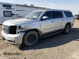 2017 Chevrolet Suburban Premier with VIN 1GNSKJKC4HR316953, listed as a Copart auction lot 76944884 with 105,753 mi miles and Salvage Title. Bid and sale history available at DreamBid. Image 1.