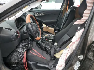 2018 Mazda CX-3 Sport z VIN JM1DKFB77J0312732, wystawiony jako Copart lot #45720065 z przebiegiem 99 866 mil mil oraz Szkoda całkowita • Salvage title. Historia ofert i sprzedaży dostępna na DreamBid. Obrazek 7.