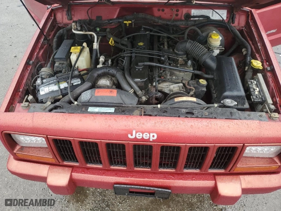 1999 Jeep Cherokee Sport with VIN 1J4FT68S1XL601799, listed as a Copart auction lot 83881844 with 203,572 mi miles and Salvage Title. Bid and sale history available at carsss.com. Image 13.