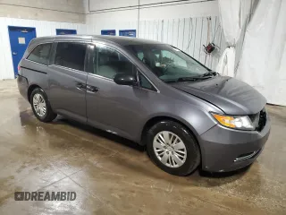 2015 Honda Odyssey LX with VIN 5FNRL5H25FB031580, listed as a Copart auction lot 48119255 with 143,552 mi miles and Salvage Title. Bid and sale history available at DreamBid. Image 4.
