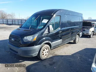 2016 Ford Transit Cargo z VIN 1FTYR2CM0GKB51759, wystawiony jako IAAI lot #41602091 z przebiegiem 158 997 mil mil oraz . Historia ofert i sprzedaży dostępna na DreamBid. Obrazek 2.