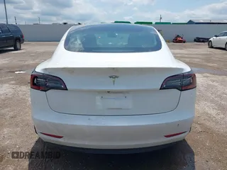 2023 Tesla Model 3 with VIN 5YJ3E1EA5PF407054, listed as a IAAI auction lot 42313770 with 57,621 mi miles and . Bid and sale history available at DreamBid. Image 16.