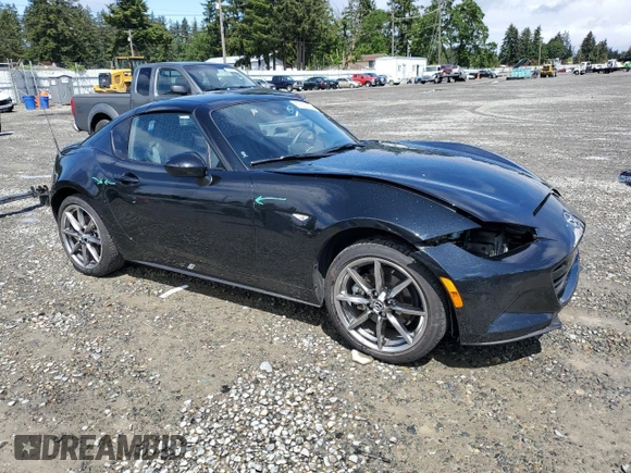 2023 Mazda MX-5 Miata Grand Touring with VIN JM1NDAM73P0561004, listed as a Copart auction lot 57362075 with 12,783 mi miles and Salvage title. Bid and sale history available at DreamBid. Image 4.