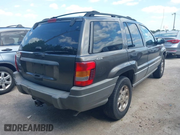 1999 Jeep Grand Cherokee Laredo with VIN 1J4GW58S2XC524365, listed as a IAAI auction lot 42432625 with 284,942 mi miles and . Bid and sale history available at DreamBid. Image 4.