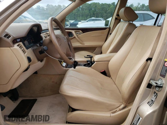 2001 Mercedes-Benz E-Class with VIN WDBJH65J41B312277, listed as a Copart auction lot 70261594 with 123,702 mi miles and Clean Title. Bid and sale history available at carsss.com. Image 7.