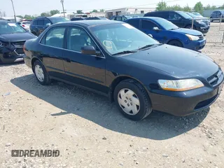 1999 Honda Accord LX z VIN 1HGCG164XXA057711, wystawiony jako IAAI lot #42415923 z przebiegiem 166 534 mil mil oraz . Historia ofert i sprzedaży dostępna na DreamBid. Obrazek 1.