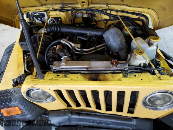 2002 Jeep Wrangler Sport z VIN 1J4FA49S02P730417, wystawiony jako Copart lot #59620865 z przebiegiem Nie podano mil oraz Szkoda całkowita • Salvage title. Historia ofert i sprzedaży dostępna na DreamBid. Obrazek 12.
