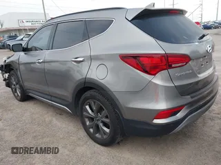 2018 Hyundai Santa Fe Ultimate with VIN 5NMZWDLAXJH100108, listed as a IAAI auction lot 42126768 with 68,325 mi miles and . Bid and sale history available at DreamBid. Image 3.