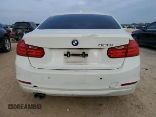 2014 BMW 3 Series 328i with VIN WBA3C1C52EK111563, listed as a Copart auction lot 51465165 with 142,125 mi miles and Salvage title. Bid and sale history available at DreamBid. Image 6.