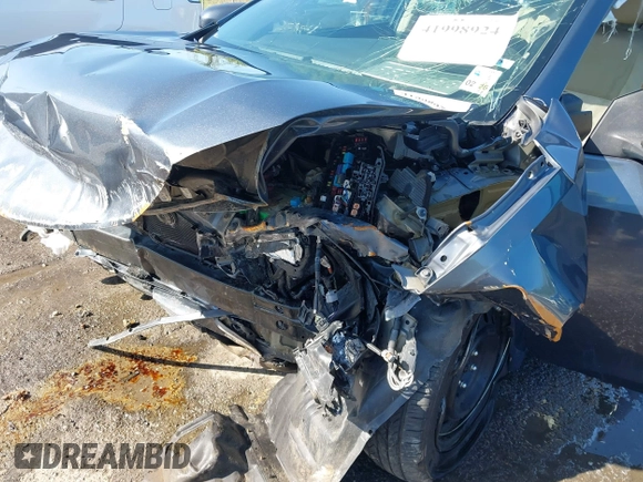 2016 Toyota Corolla L with VIN 5YFBURHE7GP457115, listed as a IAAI auction lot 41998924 with 117,445 mi miles and . Bid and sale history available at DreamBid. Image 6.