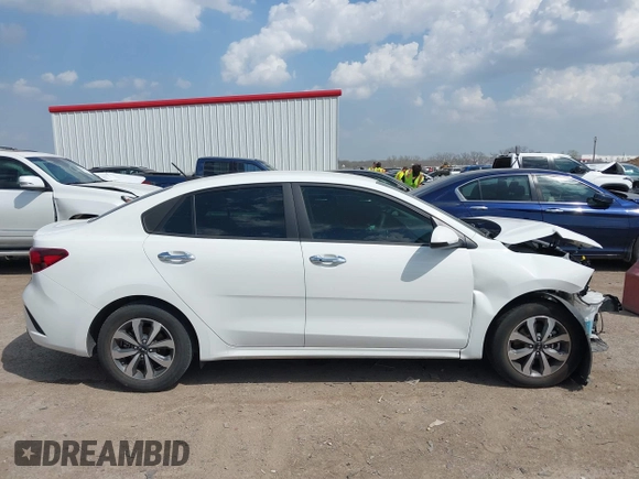 2023 Kia Rio S z VIN 3KPA24AD7PE550899, wystawiony jako IAAI lot #41882407 z przebiegiem 24 966 mil mil oraz . Historia ofert i sprzedaży dostępna na DreamBid. Obrazek 13.