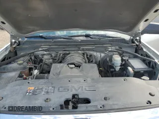 2014 GMC Sierra 1500 z VIN 1GTN1TEH2EZ270594, wystawiony jako Copart lot #76334054 z przebiegiem 102 997 mil mil oraz Szkody całkowita. Historia ofert i sprzedaży dostępna na DreamBid. Obrazek 11.