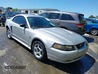 2004 Ford Mustang Standard z VIN 1FAFP40444F100675, wystawiony jako IAAI lot #41998018 z przebiegiem 173 362 mil mil oraz . Historia ofert i sprzedaży dostępna na DreamBid. Obrazek 1.