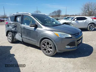 2014 Ford Escape Titanium with VIN 1FMCU9J93EUC72752, listed as a IAAI auction lot 41827668 with 91,194 mi miles and . Bid and sale history available at DreamBid. Image 1.