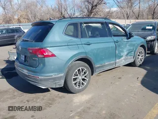 2021 Volkswagen Tiguan SE with VIN 3VV2B7AXXMM089913, listed as a IAAI auction lot 41402158 with 68,158 mi miles and . Bid and sale history available at DreamBid. Image 4.