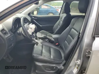 2014 Mazda CX-5 Grand Touring with VIN JM3KE4DY9E0416967, listed as a Copart auction lot 54215285 with 77,296 mi miles and Salvage Title. Bid and sale history available at DreamBid. Image 7.