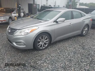2013 Hyundai Azera z VIN KMHFG4JG7DA199553, wystawiony jako IAAI lot #42218944 z przebiegiem 131 959 mil mil oraz . Historia ofert i sprzedaży dostępna na DreamBid. Obrazek 2.