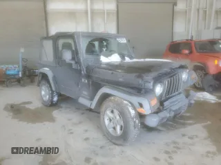 2004 Jeep Wrangler X with VIN 1J4FA39SX4P754012, listed as a Copart auction lot 45239915 with 160,473 mi miles and Salvage title. Bid and sale history available at DreamBid. Image 4.
