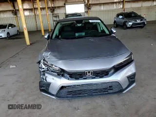 2023 Honda Civic EX-L z VIN 19XFL1H77PE004072, wystawiony jako Copart lot #49524855 z przebiegiem 21 100 mil mil oraz Szkoda całkowita • Salvage title. Historia ofert i sprzedaży dostępna na DreamBid. Obrazek 11.