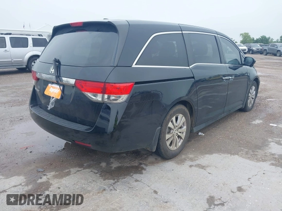 2014 Honda Odyssey EX-L with VIN 5FNRL5H64EB114709, listed as a IAAI auction lot 42131146 with 145,616 mi miles and . Bid and sale history available at DreamBid. Image 4.