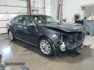 2014 Lincoln MKS with VIN 1LNHL9DK1EG606556, listed as a IAAI auction lot 41332774 with 147,577 mi miles. Bid and sale history available at carsss.com. Image 1.